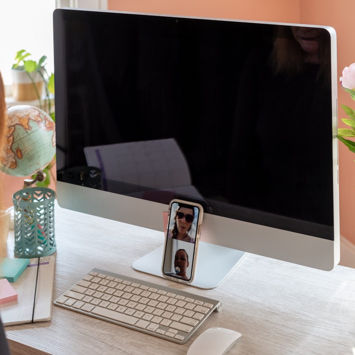 a-woman-sitting-at-desk-in-home-office-video-chatt-2023-11-27-04-55-41-utc